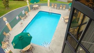 Seasonal outdoor pool, open 9:00 AM to 11:00 PM, pool umbrellas