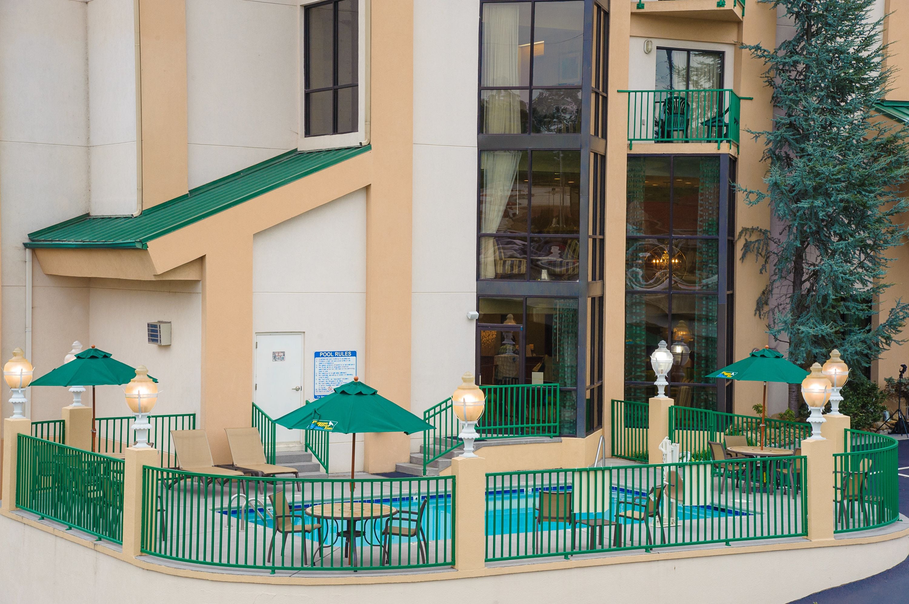 seasonal outdoor pool, open 9:00 am to 11:00 pm, pool umbrellas