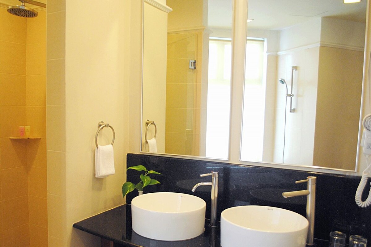 Bathroom | Shower, hair dryer, slippers, towels
