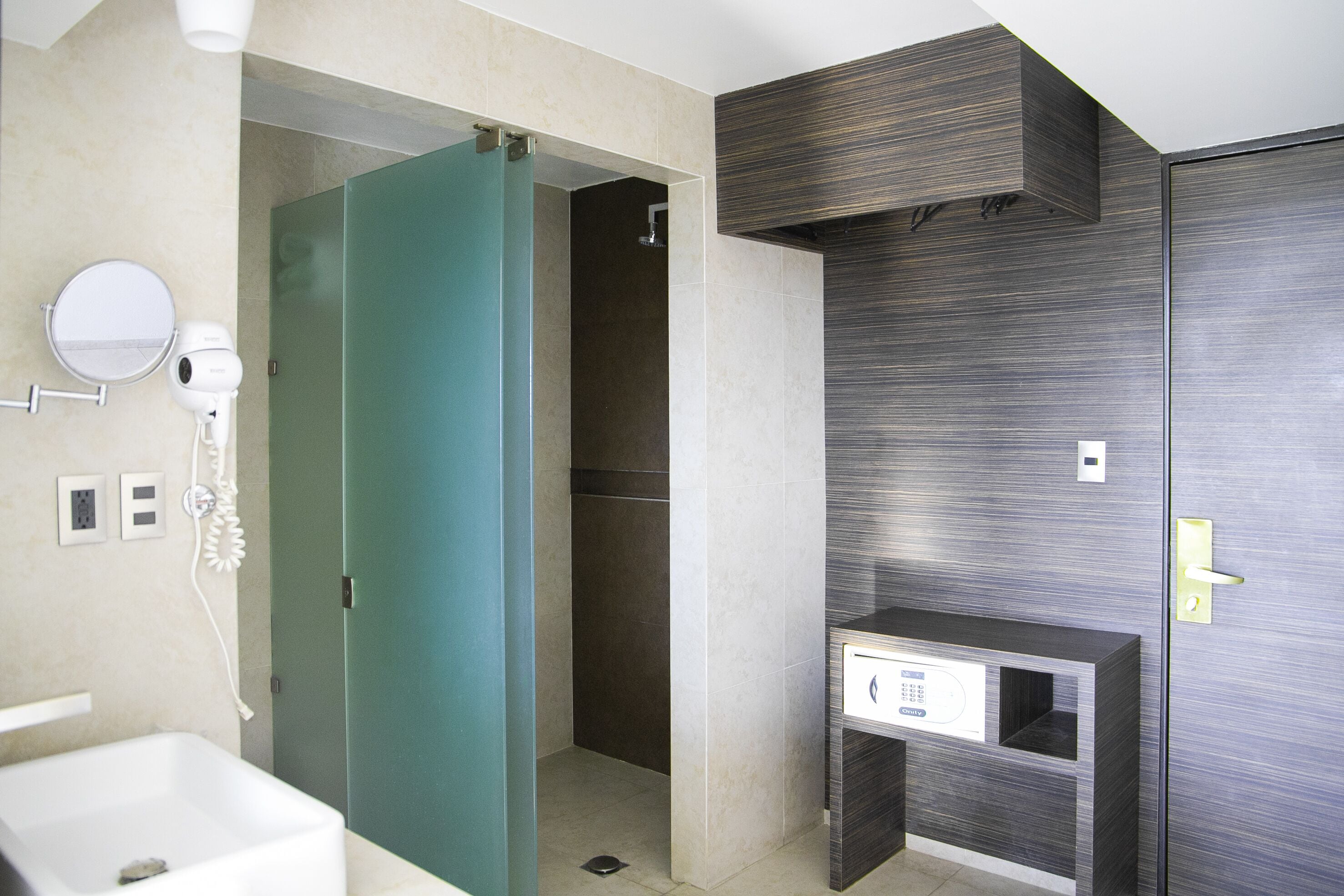 Shower, rainfall showerhead, hair dryer, towels