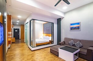 One Bedroom Suite Queen | Living room | 32-inch flat-screen TV with satellite channels, TV