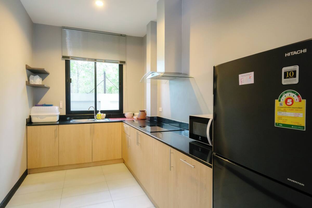 fridge, coffee/tea maker, electric kettle, dining tables