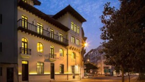 A multi-story building with balconies and illuminated windows, suggesting a hotel or residential building. - Altiplanico Bellas Artes (Santiago)