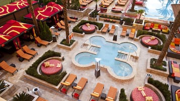 Relax by the central pool surrounded by comfortable seating areas.