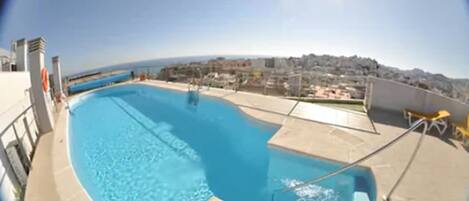 Outdoor pool, pool umbrellas, pool loungers