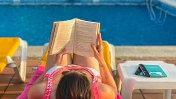 Relax by the pool with a good book and enjoy the tranquil atmosphere.
