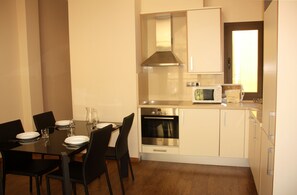 Apartment, 2 Bedrooms | Private kitchen | Full-size fridge, microwave, dishwasher, coffee/tea maker