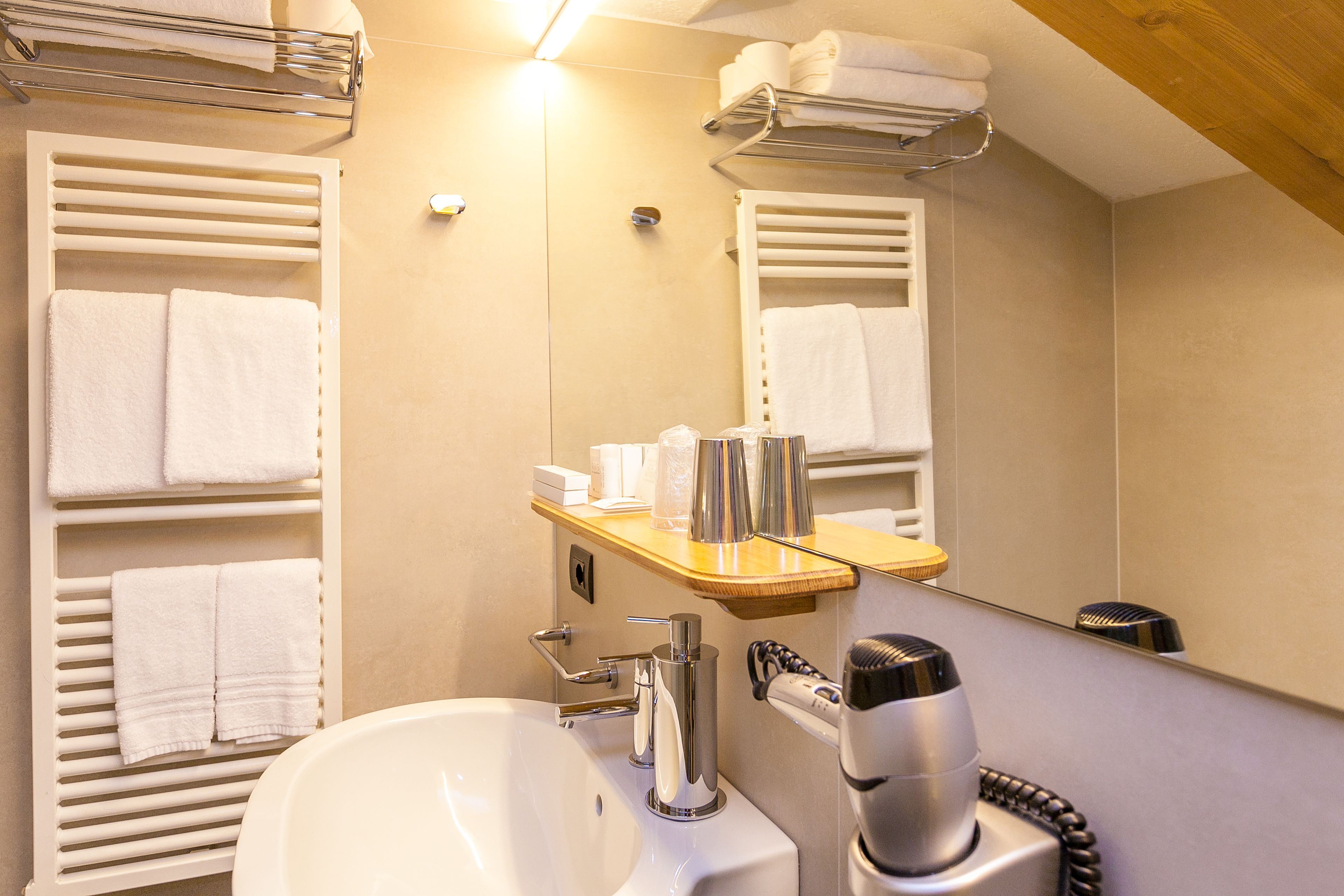 junior suite | bathroom | shower, free toiletries, hair dryer, bathrobes