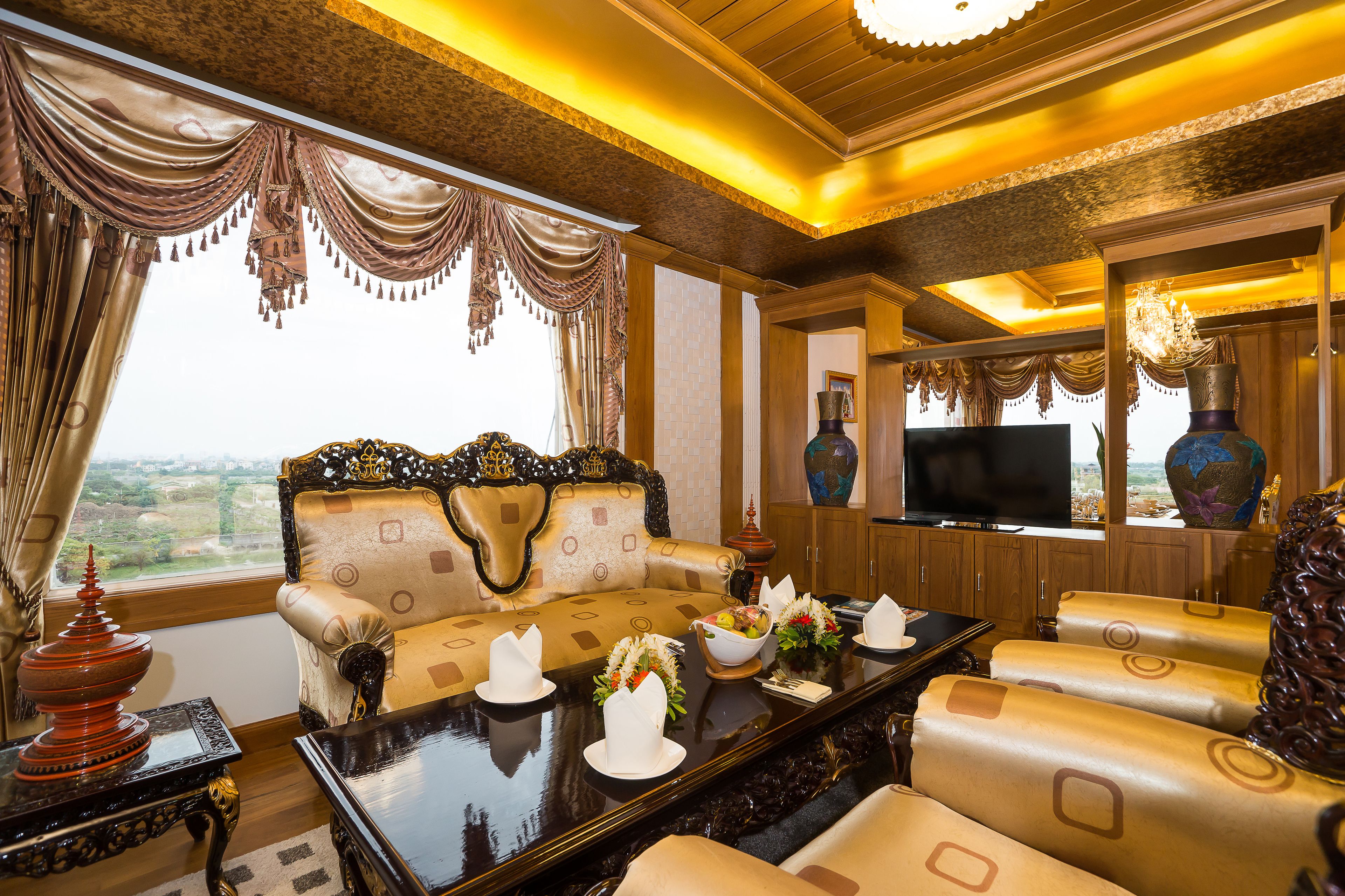 premier suite, 1 king bed, non smoking | living area | 42-inch flat-screen tv with satellite channels, tv, dvd player