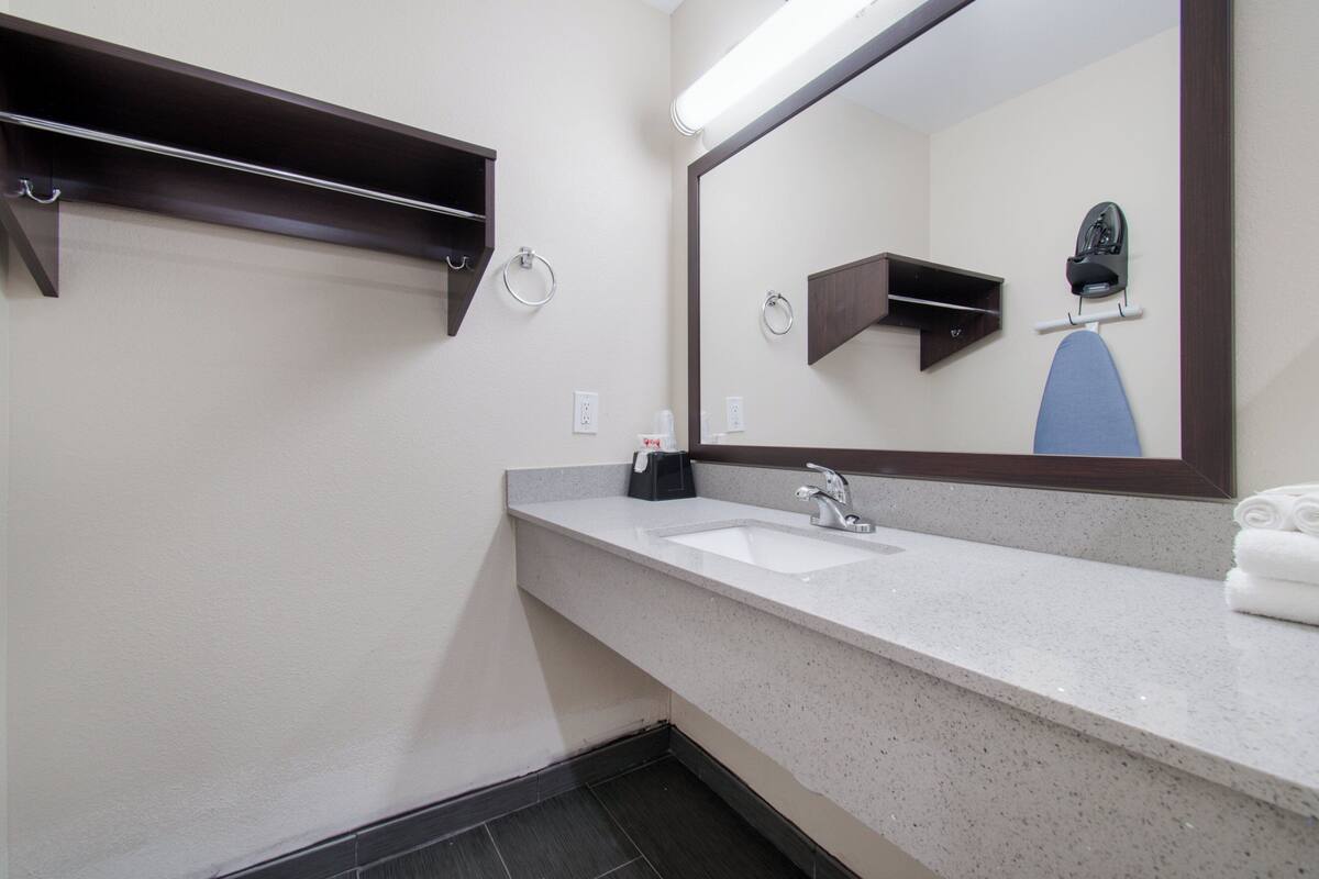 Blackout drapes, cribs (free), WiFi (free), bed sheets
