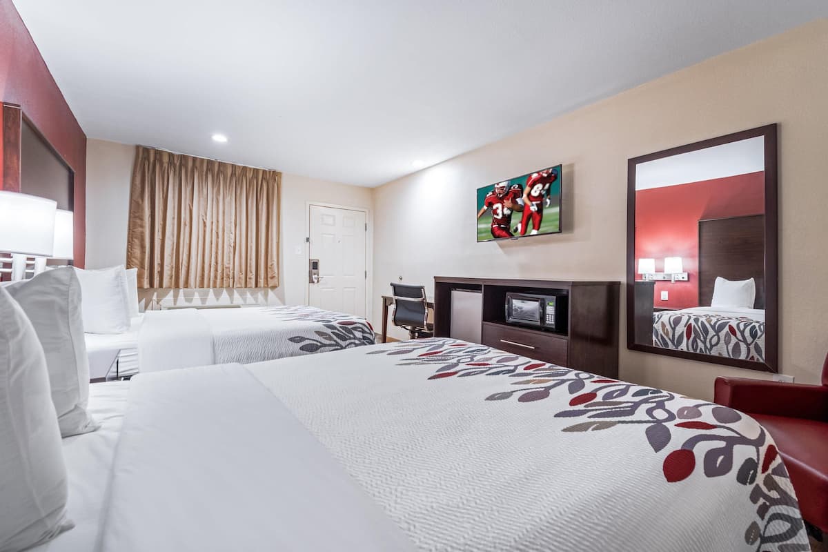 Blackout drapes, cribs (free), WiFi (free), bed sheets