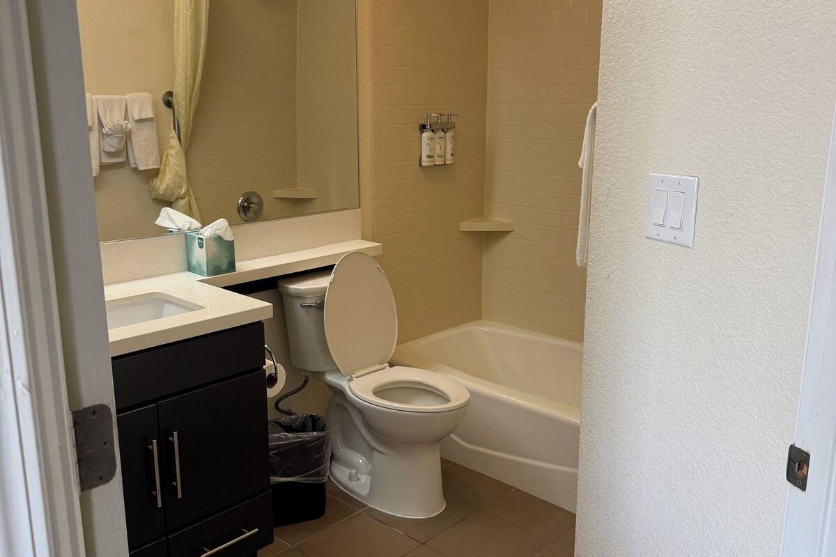 studio suite, 2 queen beds | bathroom | hair dryer, towels