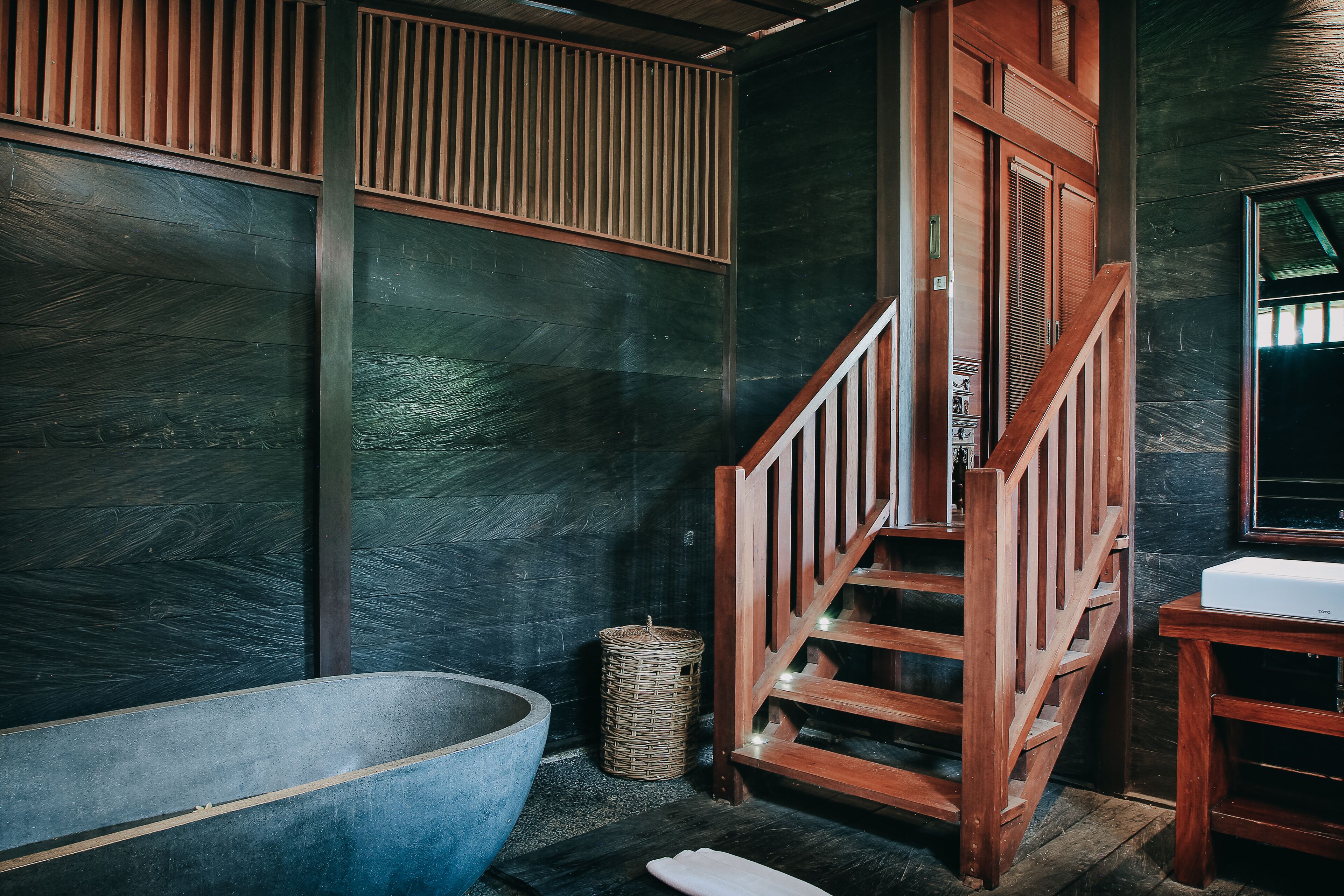 designer toiletries, hair dryer, bathrobes, slippers