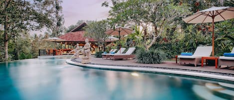 2 outdoor pools, a natural pool, open 7 AM to 6 PM, pool umbrellas