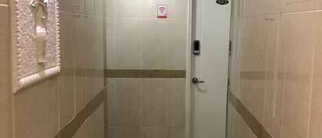 A hallway with a door marked 503, a handrail, and a sign indicating Wi-Fi availability.