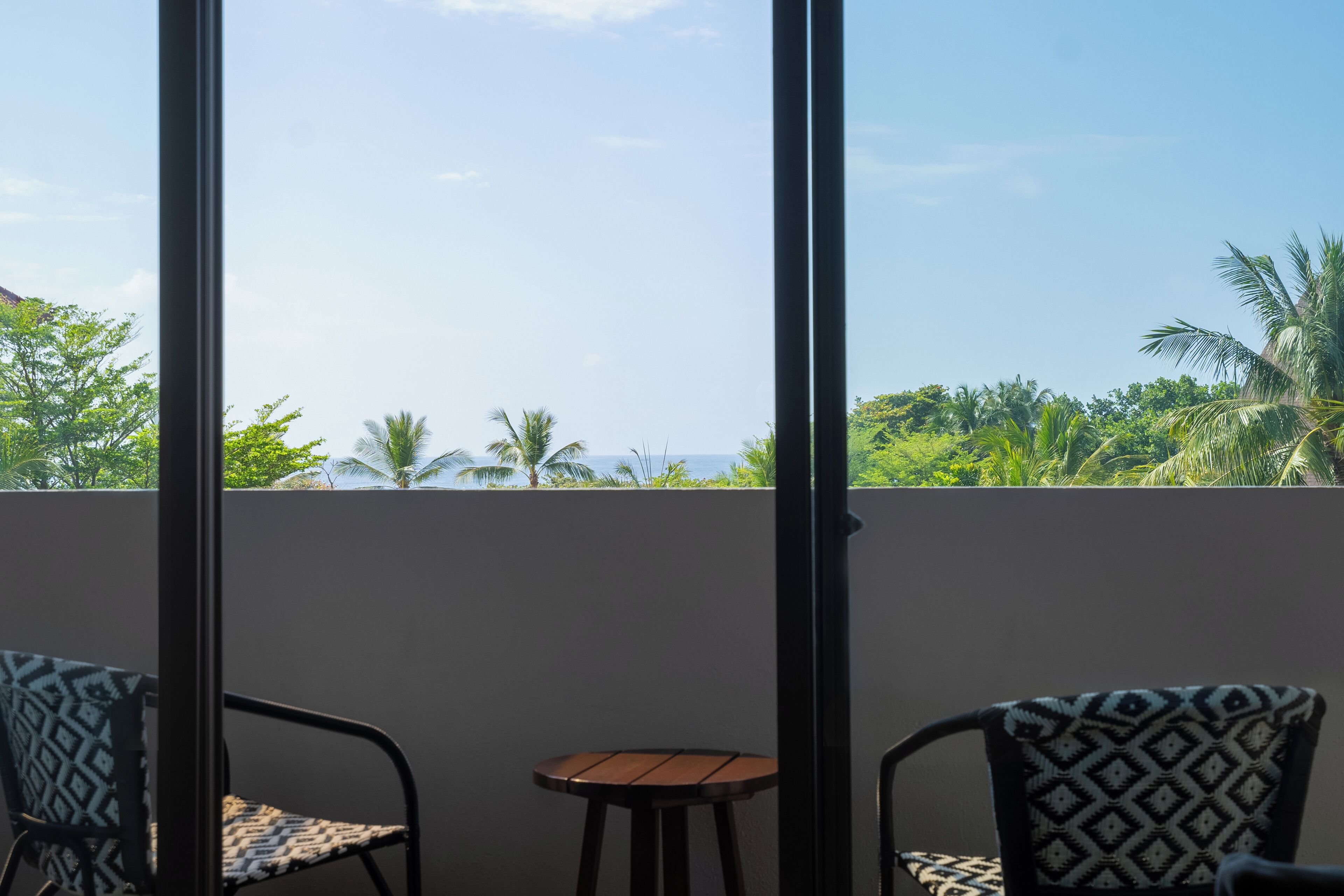 deluxe room, ocean view | 1 bedroom, minibar, in-room safe, desk
