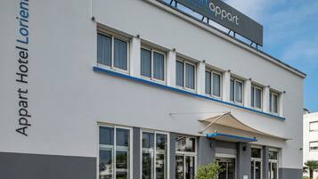 A two-story building with a sign reading "Smartappart" and "Appart Hotel Lorient" indicating it is a Smartappart hotel in Lorient.