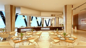 Un restaurant moderne doté d’un bar central, de nombreuses tables et de chaises.