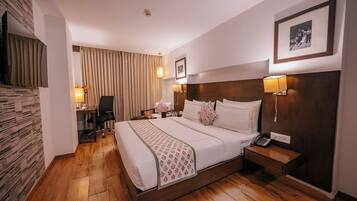 Habitación ejecutiva | 1 dormitorio, minibar, caja fuerte y decoración individual