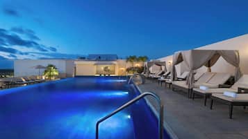 Outdoor pool, open 8 AM to 8 PM, free pool cabanas, pool umbrellas