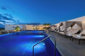 Outdoor pool, open 8 AM to 8 PM, free pool cabanas, pool umbrellas