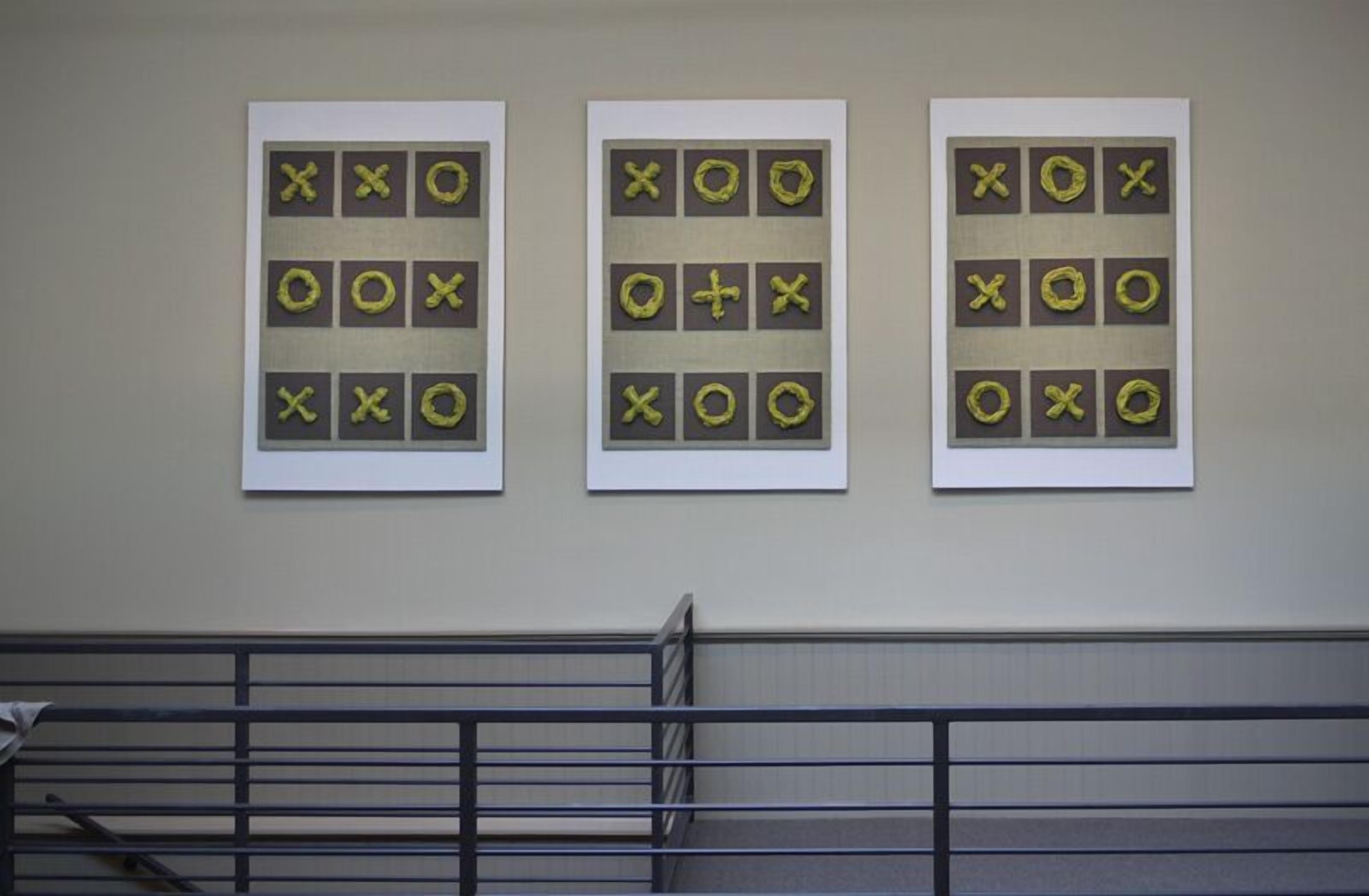 Three framed wall art pieces with abstract designs.