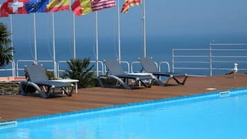 Seasonal outdoor pool, pool umbrellas, pool loungers