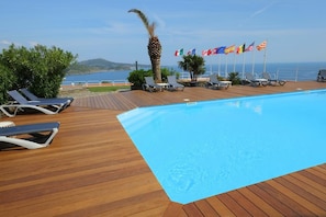 Seasonal outdoor pool, pool umbrellas, sun loungers
