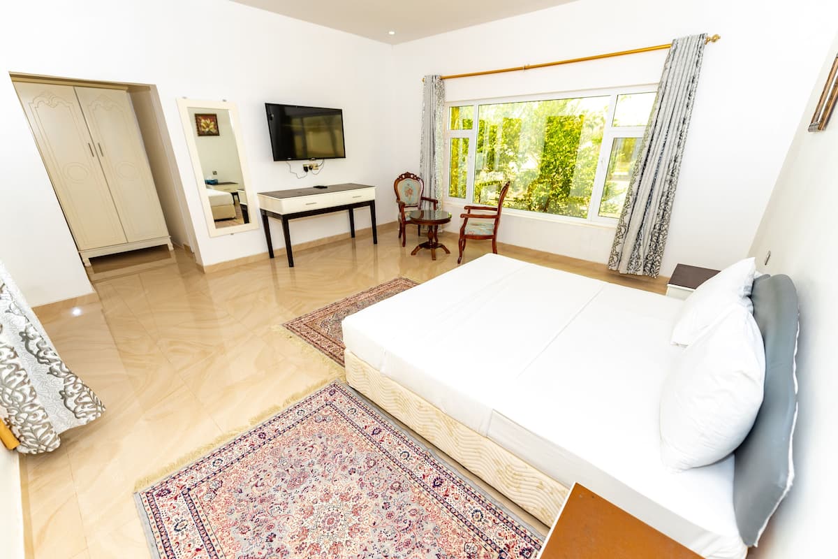 Junior Room, 1 Queen Bed, Garden View | 2 bedrooms, down comforters, free WiFi
