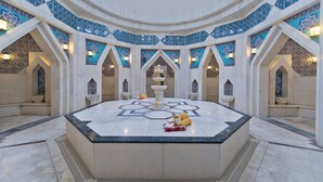 A spacious lobby with a central fountain, ornate tile work, and a high ceiling. - Kamelya Selin Hotel Luxury Resort & SPA (Manavgat)