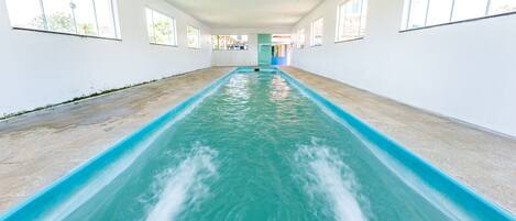 Indoor pool, outdoor pool, pool umbrellas, pool loungers