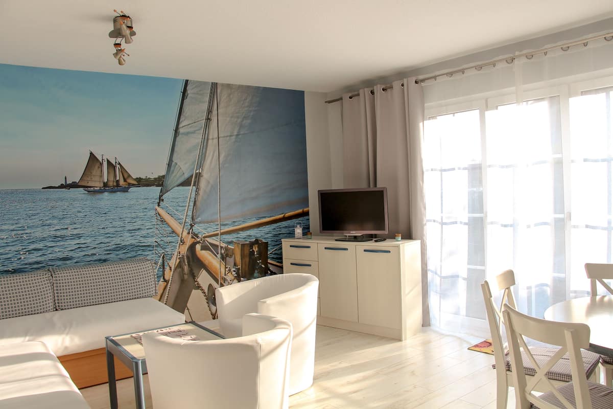 Cottage, 2 Bedrooms (80qm) | Living room | Flat-screen TV