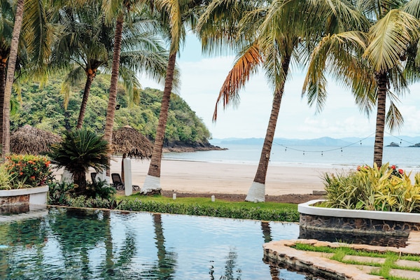 On the beach, sun loungers, surfing