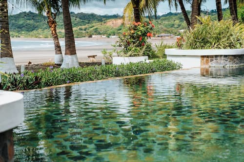 Outdoor pool, open 8:00 AM to 6:00 PM, pool umbrellas, sun loungers