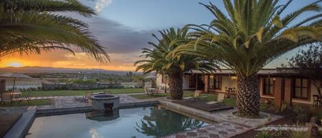 Outdoor pool, pool umbrellas, sun loungers