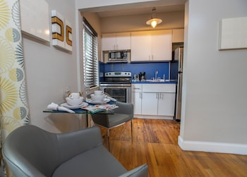 Studio Queen | Private kitchen | Full-size fridge, microwave, oven, stovetop at Beachside All Suites Hotel