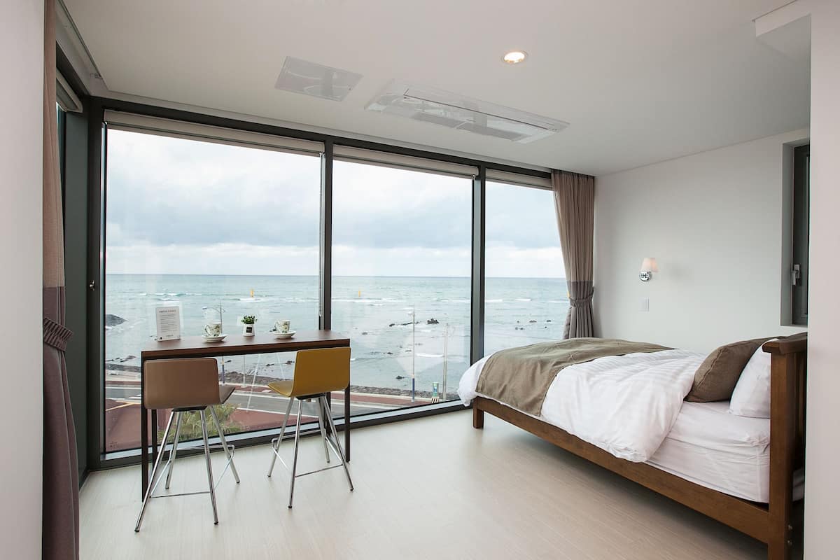 Premium Double | Premium bedding, pillow-top beds, desk, blackout curtains