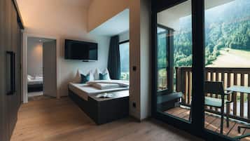 Suite studio | Aire de séjour | Téléviseur à écran plat