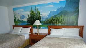 A hotel room with two beds, a nightstand with a lamp, and a large mural of a mountain landscape. - Westmount Motel (South-West Oxford)