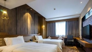 A hotel room with two beds, a desk, a chair, a television, and a large window with curtains. - Gondola Taikoo Hotel (Guangzhou)
