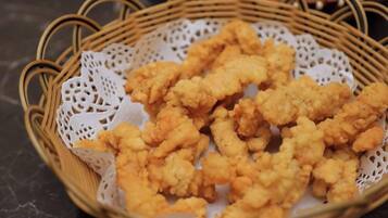 A basket of fried food items.