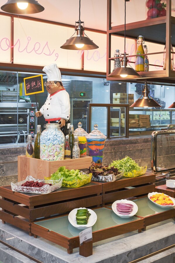 A buffet setup with various food items and a chef's hat on a stand. - Holiday Inn Taiyuan City Center by IHG (Taiyuan)