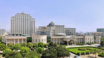 A large building complex with multiple structures, including a tall building and several smaller buildings with domed roofs.