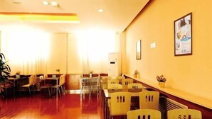 A hotel lobby with a long reception desk, multiple seating areas with chairs, and a large window providing natural light. - Jinjiang Inn Style Taiyuan Exhibition Center (Taiyuan)