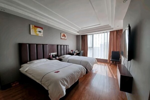 A hotel room with two beds, a flat-screen TV, a desk, and a large window. - Kunlun Leju Hotel (Wenxian Branch) (Wen County)
