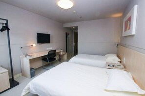 A hotel room with two beds, a desk, a chair, a TV, and a wardrobe. - Jinjiang Inn Fuyang Yingshang Road (Fuyang)