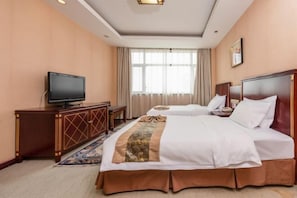 A hotel room with two beds, a television, a desk, and a large window. - Yellow River Pearl Hotel (Yinchuan)