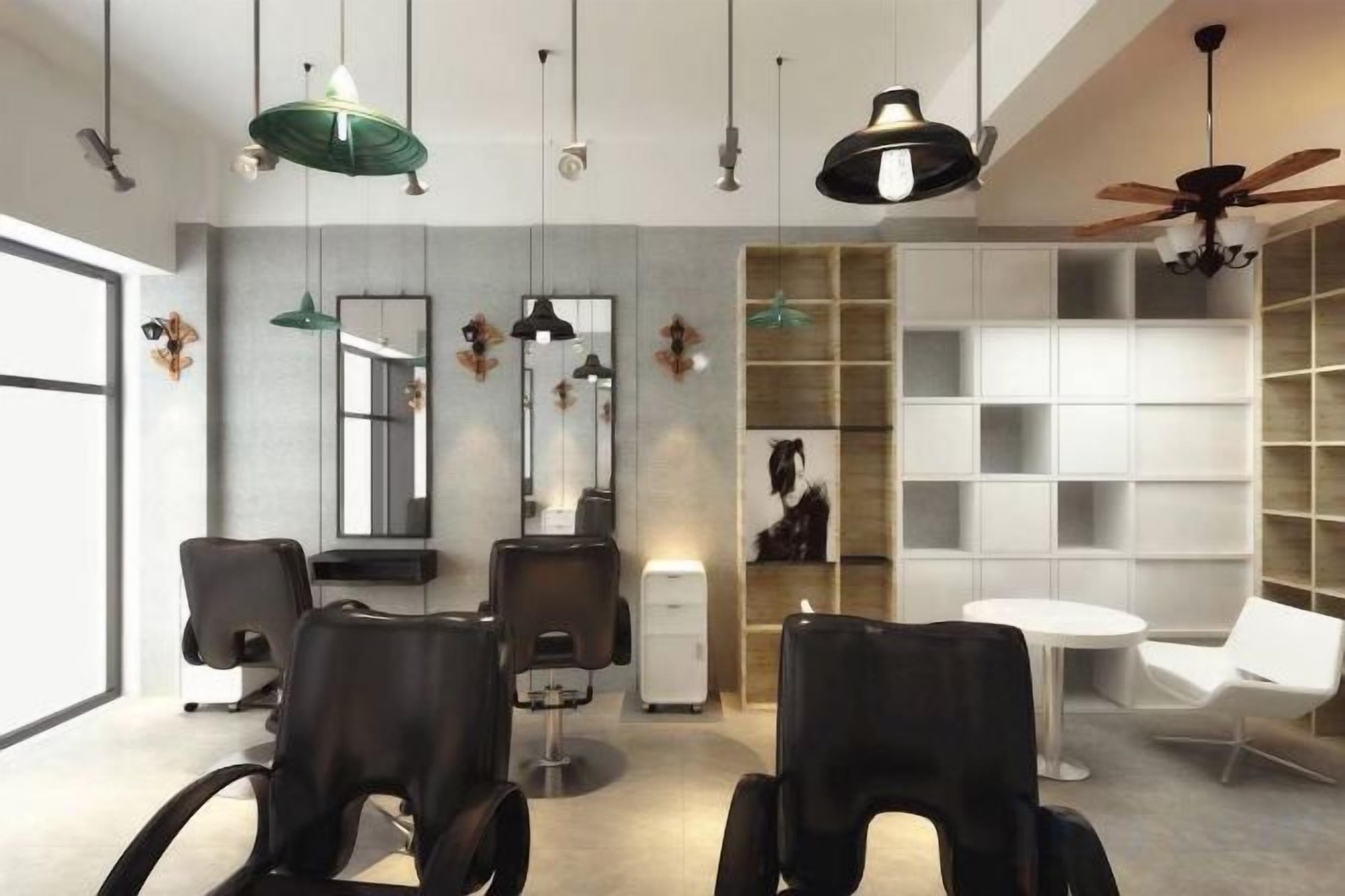 A modern hair salon with multiple chairs, mirrors, and a ceiling fan.