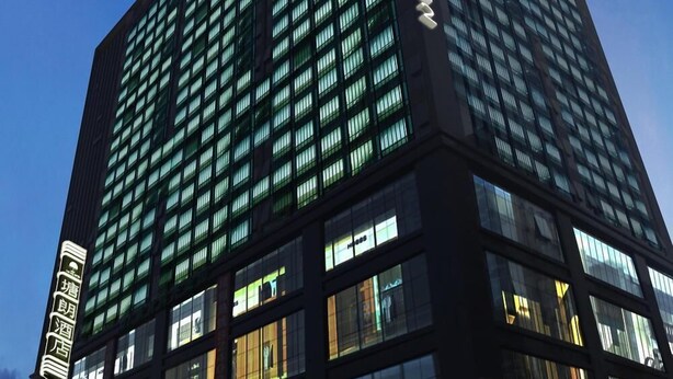 A modern high-rise building with multiple floors and large windows. - Art Hotel (Shenzhen)