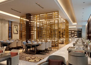 A modern dining area with multiple tables and chairs, a decorative wooden partition, and a chandelier. - Holiday Inn Beijing Airport Zone by IHG (Beijing)